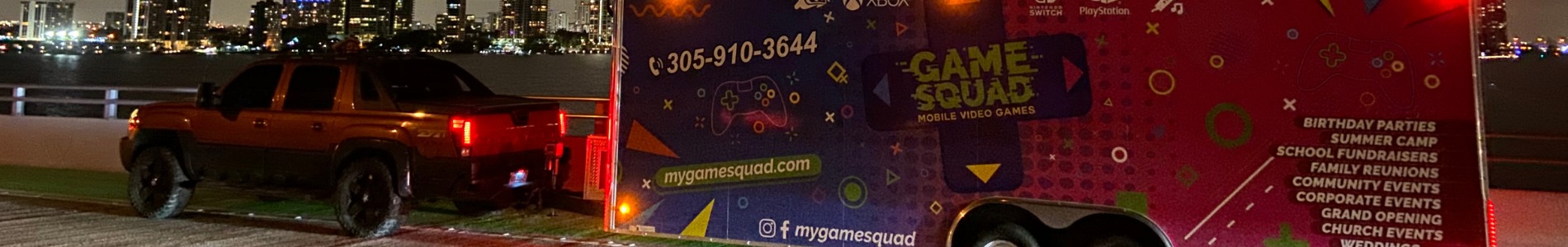 My Game Squad mobile game truck parked for an October birthday party in Miami with laser lighting and current-gen consoles